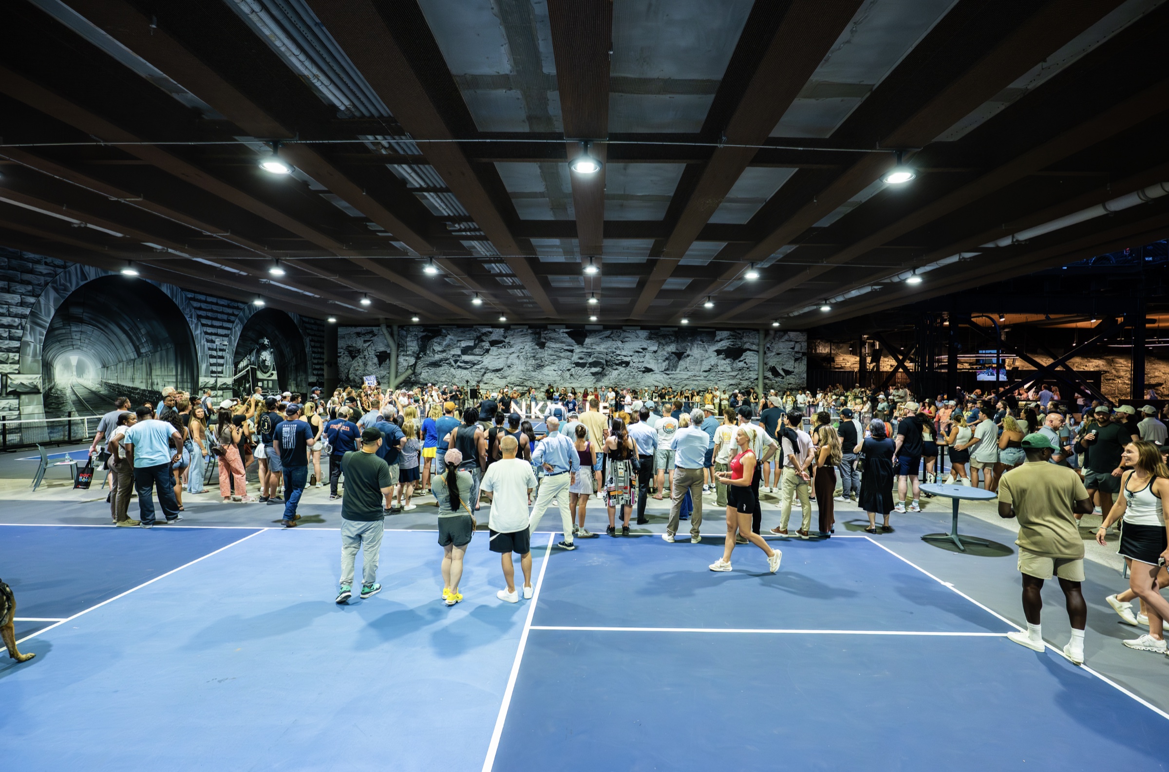 A packed private event on the courts at Dinkville Under Broad